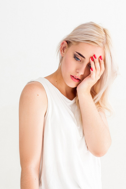 Attractive blonde woman with headache - Fotoğraf, Görsel