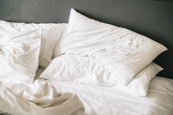 White pillow on bed - Фото, зображення