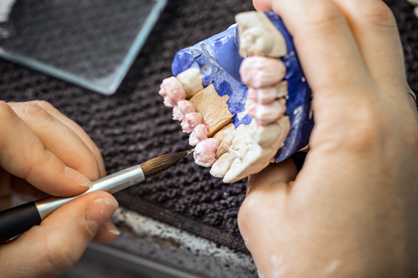 Dental technician working - Фото, изображение