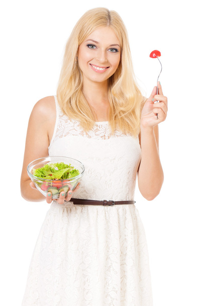 жінка їсть свіжий салат
 - Фото, зображення