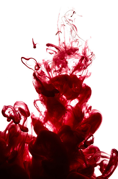 Abstract splash of red paint isolated  - Фото, изображение