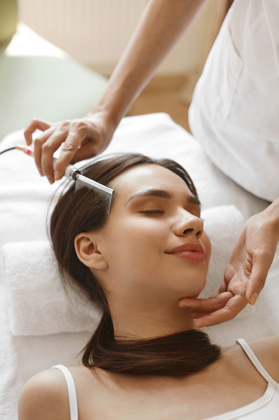 Hair Care. Beautiful Woman Receiving Brushing Beauty Treatment - Photo, image