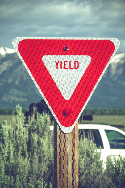 Large red yield sign in a countryside - Photo, Image