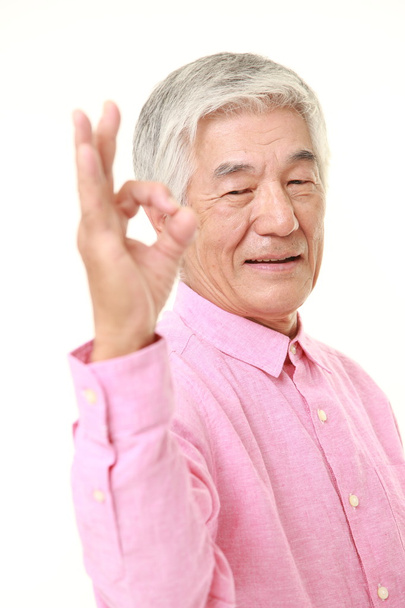 senior Japanese man showing perfect sign - 写真・画像