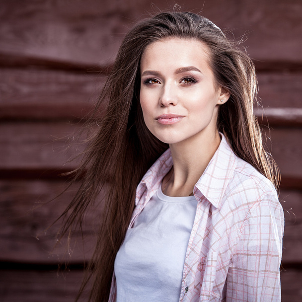 Young sensual & beauty girl pose against grunge wooden background - Photo, Image
