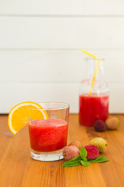 Watermelon smooties in glass with orange slice and lichee - Photo, Image