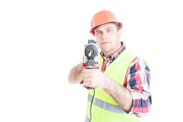 Handsome constructor holding electric drilling machine - Foto, Bild