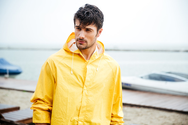 Portrait of a sailor man in yellow cloak - Foto, imagen