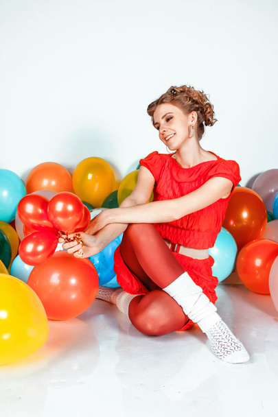portrait of a girl with balloons smiling - Photo, image