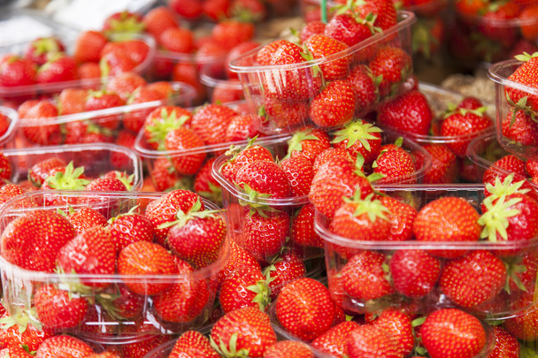 Tasty strawberry in boxes on a counter of shop - Фото, зображення