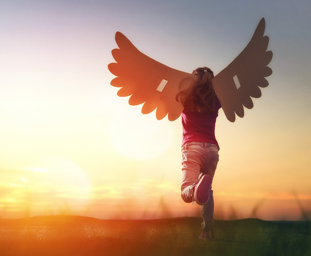 Kid with the wings of a bird - Photo, image