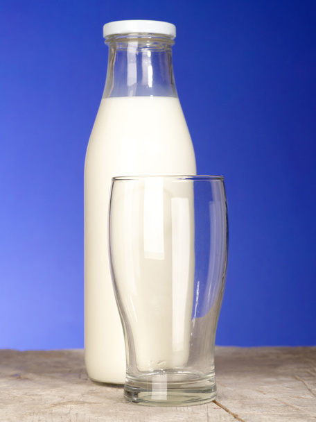 Bottle with fresh milk and glass on the - Fotó, kép