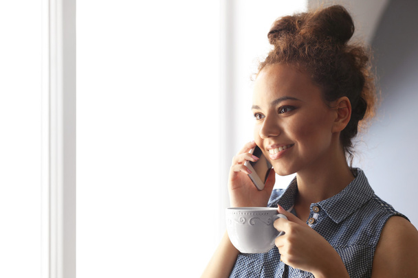 African American girl drinking coffee - Foto, Imagen