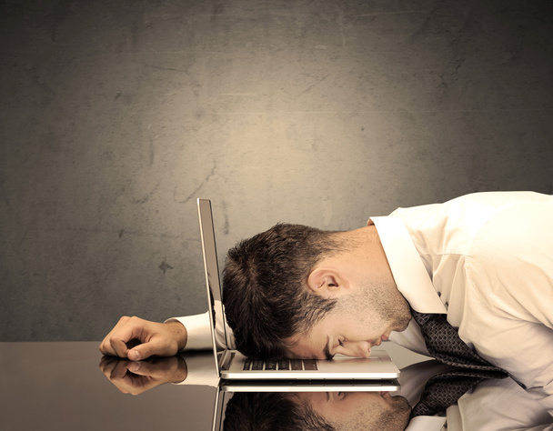 Frustrated businessman's head on keyboard - Foto, Imagen