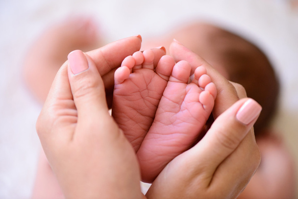 tiny foot of newborn baby - Photo, Image
