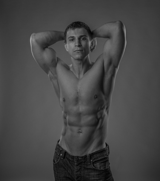 Perfectly fit shirtless young man - Фото, изображение