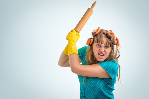 Mad and crazy housewife woman with kitchen roller - Photo, Image
