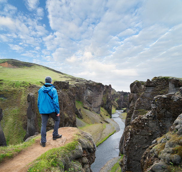 Tourist standing on the top of the canyon in Iceland - Zdjęcie, obraz