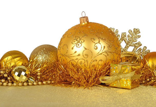 Golden Christmas decorations on a white  - Fotoğraf, Görsel