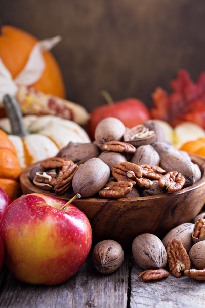 Fall harvest concept - nuts and pumpkins - Fotó, kép