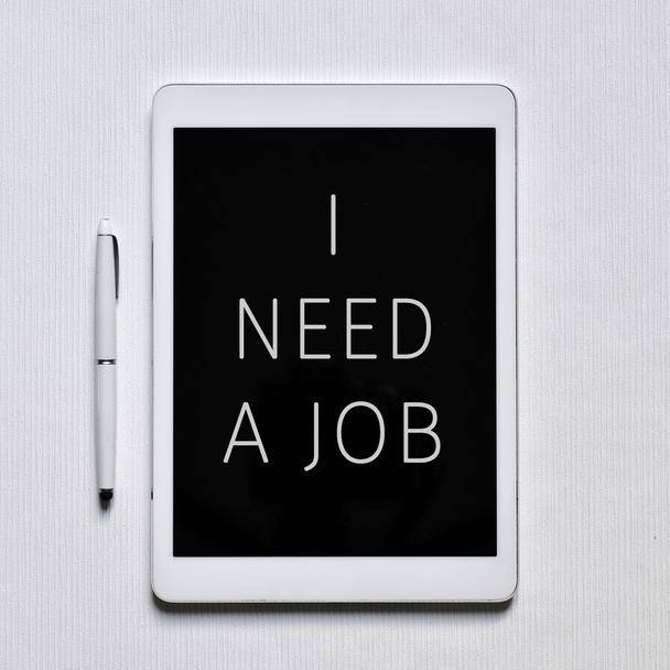 text I need a job in a tablet - Foto, Bild
