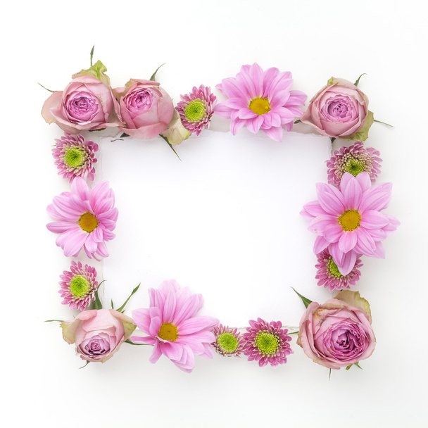 Pink flowers frame with space for text. Flat lay. Top view - Foto, imagen