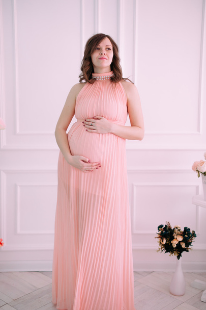 Happy pregnant young woman waiting for a child - Фото, изображение