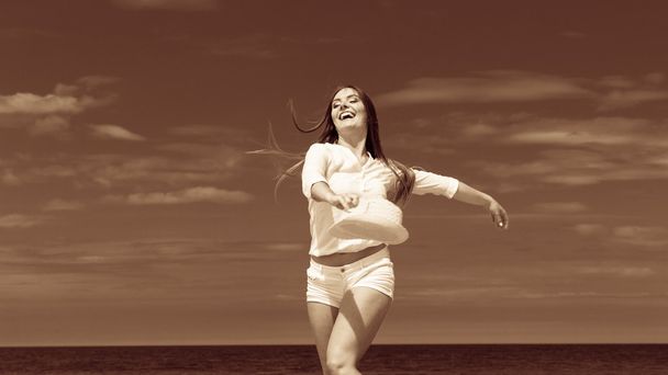 Happy woman on summer beach. - Фото, изображение