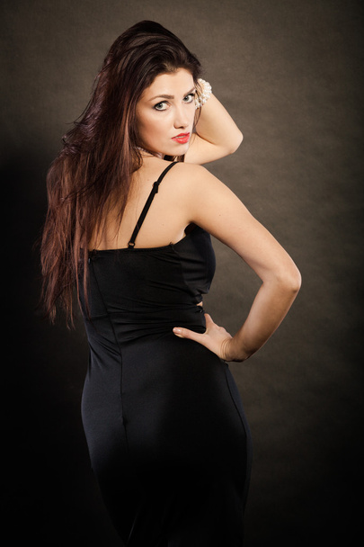 woman in sensual black dress on dark - Fotografie, Obrázek