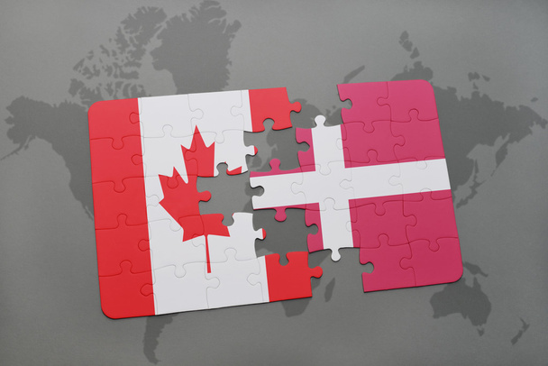puzzle a nemzeti zászló Kanada és Dánia a világtérképen háttér. - Fotó, kép
