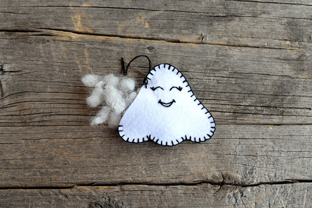 Sewing Halloween ghost decor. Join the felt edges of the toy using a blanket stitch and stuff with hollowfiber. Step. Instruction for children. Autumn festive diy idea. Closeup. Top view  - Photo, Image
