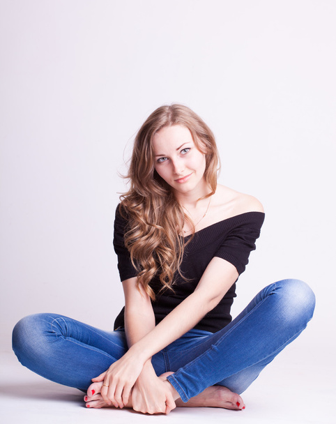 A beautiful young girl in jeans, natural style - Фото, зображення