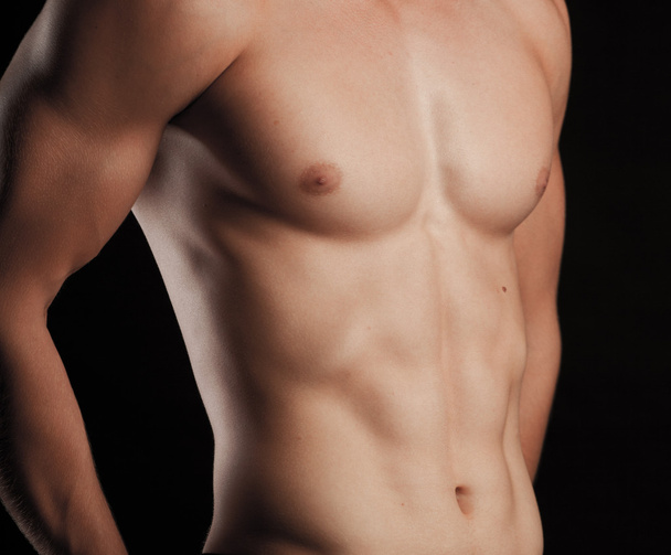 Muscular young sexy nude man on studio - Φωτογραφία, εικόνα