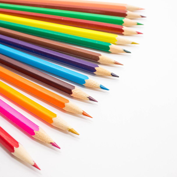 Colored pencils on white background. - Zdjęcie, obraz