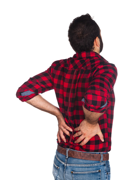 Holzfäller im karierten Hemd mit Rückenschmerzen - Foto, Bild