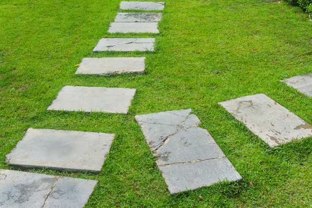 Outdoor marble pathway through green lawn - Photo, Image