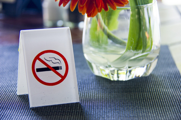 No smoking sign displayed on table - Photo, Image