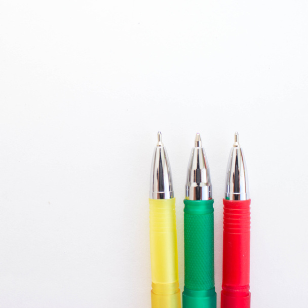 Multicolored pens on white background. - Photo, Image