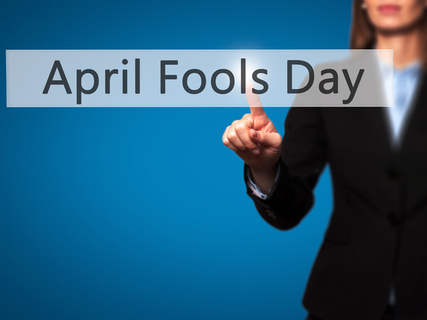 April Fools Day - Isolated female hand touching or pointing to b - Photo, Image