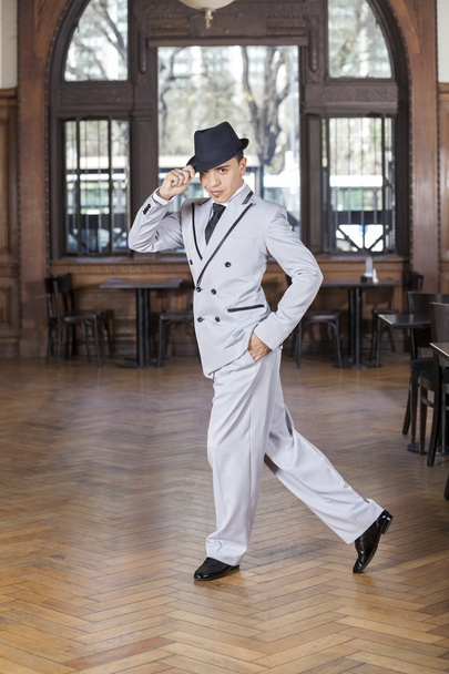 Confident Dancer With Hand In Pocket Performing Tango - 写真・画像