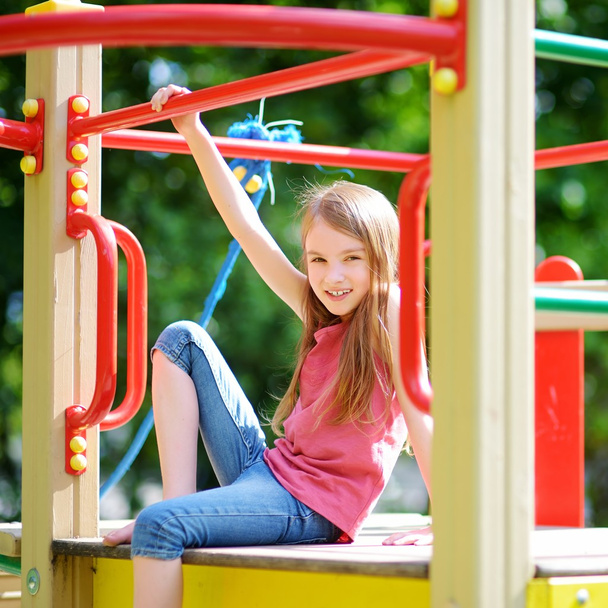 Little girl having fun on playground - Fotografie, Obrázek