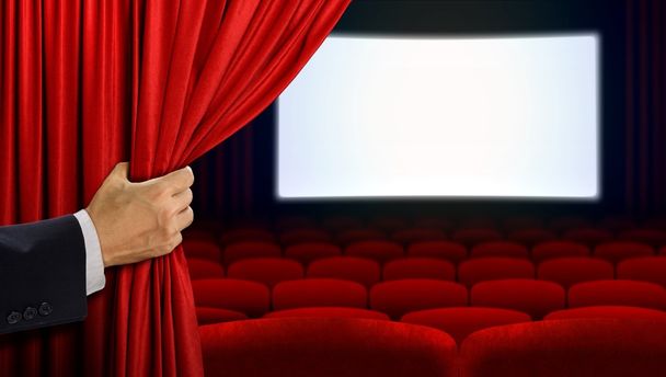 Hand opening curtain before movie show - Photo, Image