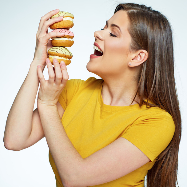 woman holding pile of cakes - Photo, Image