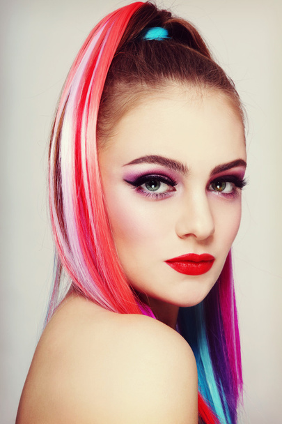 Beautiful girl with colorful ponytail  - Fotó, kép