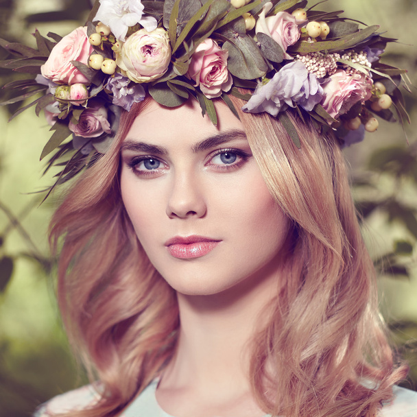 Beautiful blonde woman with flower wreath on her head  - Fotoğraf, Görsel