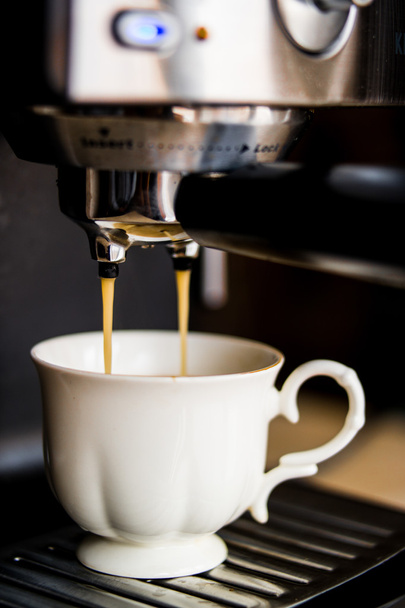 espresso machine making coffee and pouring in a white  cup - Foto, immagini