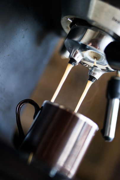 espresso machine making coffee and pouring in a brown  cup - Fotoğraf, Görsel