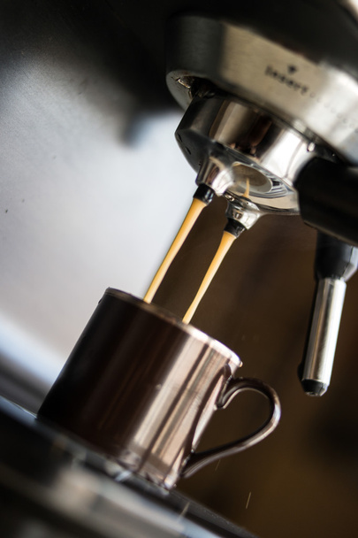 espresso machine making coffee and pouring in a brown  cup - Zdjęcie, obraz
