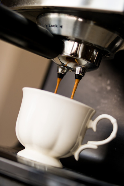 espresso machine making coffee and pouring in a white  cup - Фото, изображение