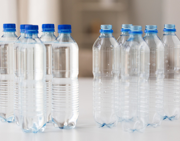 close up of bottles with drinking water on table - Valokuva, kuva